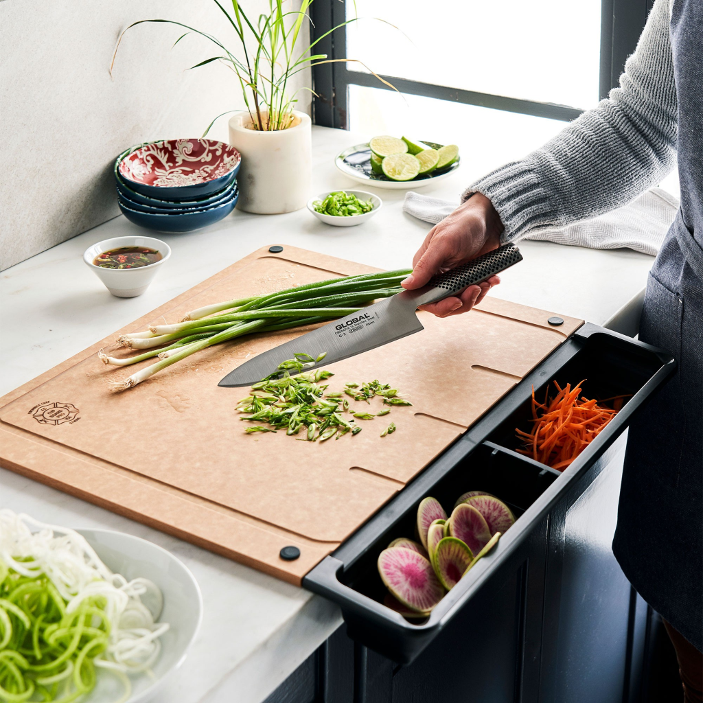The Cup Board Pro cutting board tray revolutionizes your kitchen experience. All five sharks invested in this innovative cutting board with divots for catching juices and a detachable tray for easy cleanup.